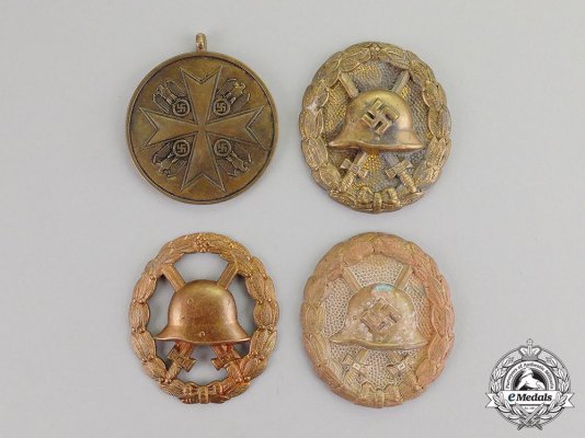 FOUR ZIMMERMANN RECOVERED FIRST AND SECOND WAR BADGES AND MEDALS.jpg