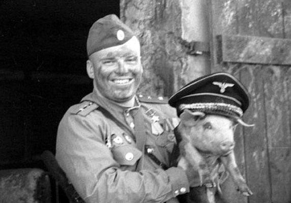 Russian soldier holding a pig.jpg