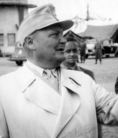 3. Hermann Goering waits to board the plane to Camp Ashcan, a temporary prisoner-of-war camp in .jpg