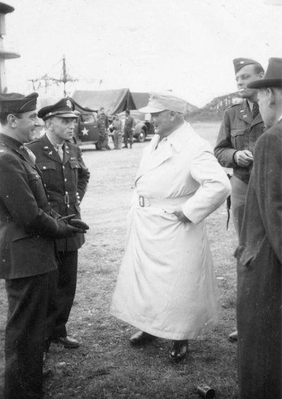4. Hermann Goering waits to board the plane to Camp Ashcan, a temporary prisoner-of-war camp in .jpg