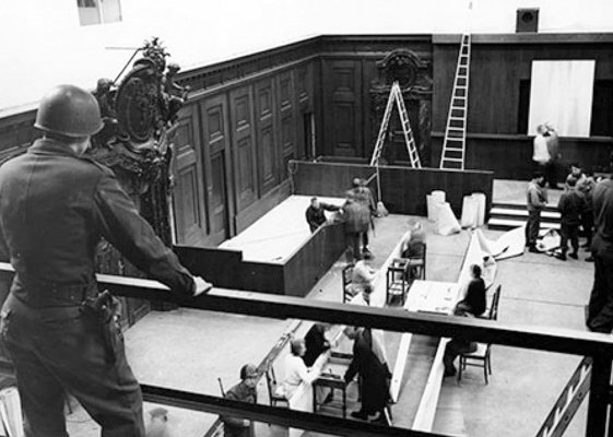 PFC Carl D. Sander oversees repairs to the courtroom inside the Palace of Justice, Nuremburg..jpg
