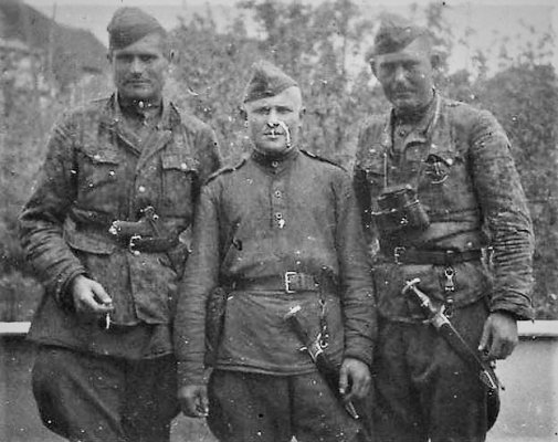 Russian soldiers with  captured SS daggers.JPG