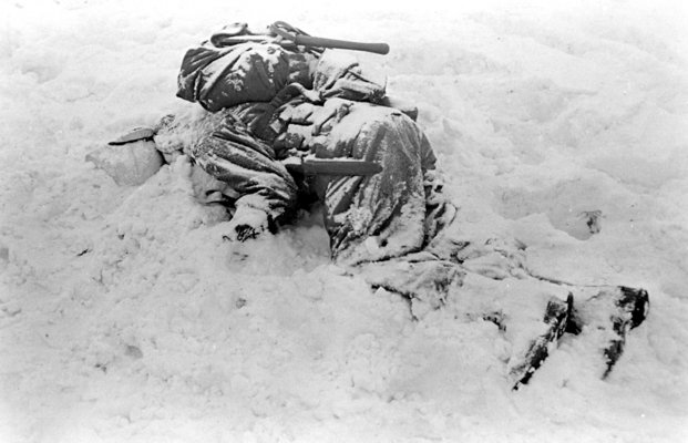 Dead American soldier lies in the snow_Belgium Dec 1944.jpg